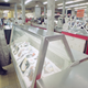 A Soviet woman stares at rows of empty refrigerators used for storing milk, instead the refrigerators are used to display plastic shopping bags at a local supermarket in Moscow on Tuesday, Nov. 27, 1990.